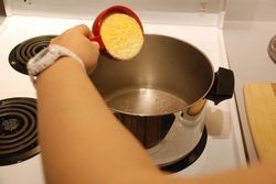 Add polenta to water