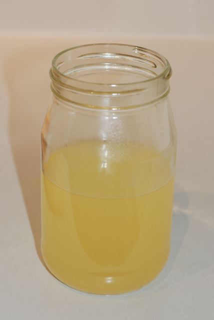 Jar of whey drained from the soy curds
