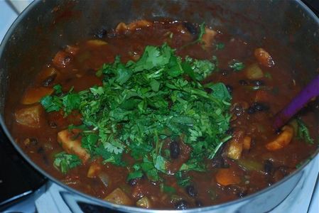 Add cilantro to the chili, sitr to mix in, and let sit for 5 minutes
