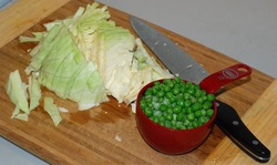 Shredded cabbage and frozen peas