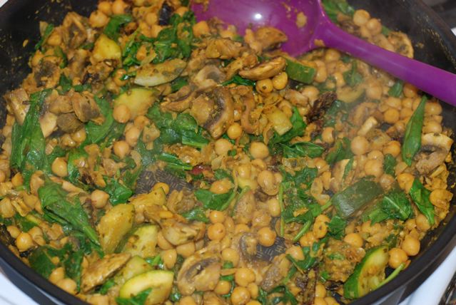 Mix the spinach into the chickpeas and cook until wilted