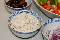 Place the onion, olices and soy feta in separate bowls