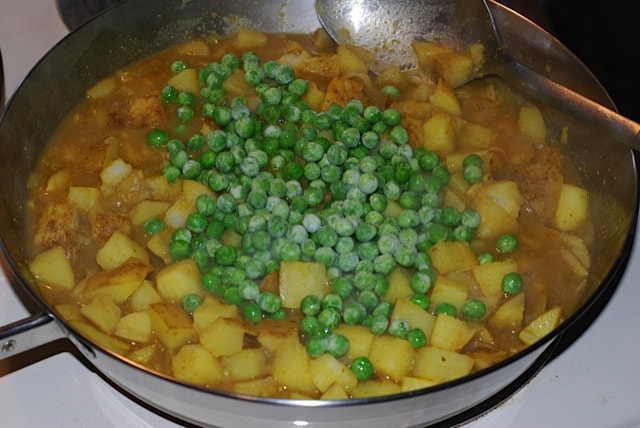 Stir in the frozen peas--North Indian Potatoes and Greens/beansriceeverythingnice@weebly.com