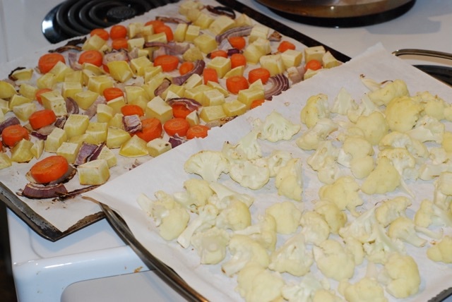 Two trays of roasted vegetables