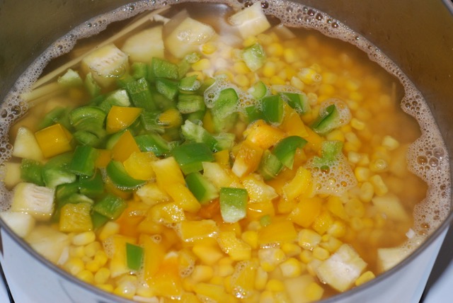 Add the corn and diced peppers