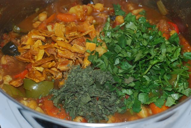 Add the dried fruit, chopped cilantro and dried mint