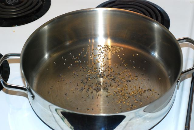 Mustard and cumin seeds in a dry pan