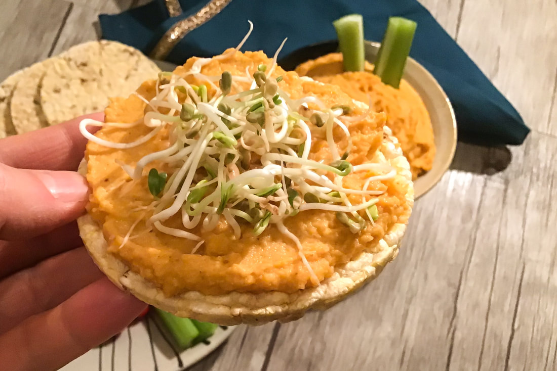 Carrot Hummus on a corn thin with fenugreek sprouts—Carrot hummus / Gluten-Free, Oil-Free, Vegan—beansriceeverythingnIce.weebly.com