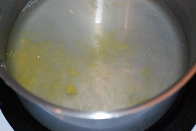 Lemon juice and zest on a pot with water