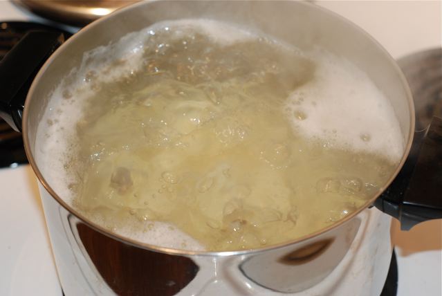 Par-boiling the potatoes before baking