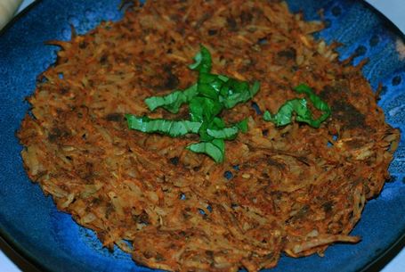 Finish Pizza hash Brown with fresh basil