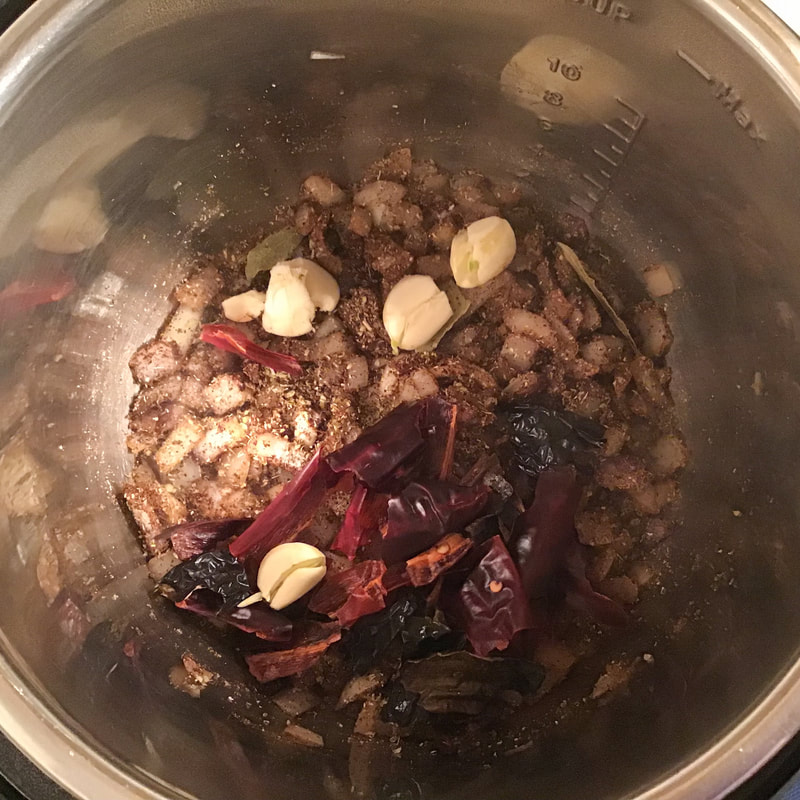 Add the garlic and toasted chilis—Spicy Black Bean Soup—Instant Pot recipe / Fat-Free, Gluten-Free, Vegan—https://beansriceeverythingnice.weebly.com