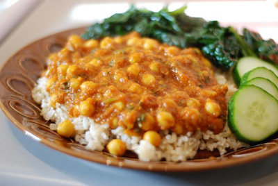 Chana Masala served over brown rice with steamed kale on the side--beansriceeverythingnice@weebly.com